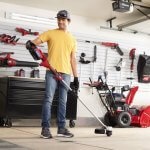 man prepping a toro weed wacker