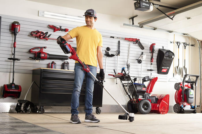 man prepping a toro weed wacker