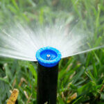Close up of blue irrigation nozzle