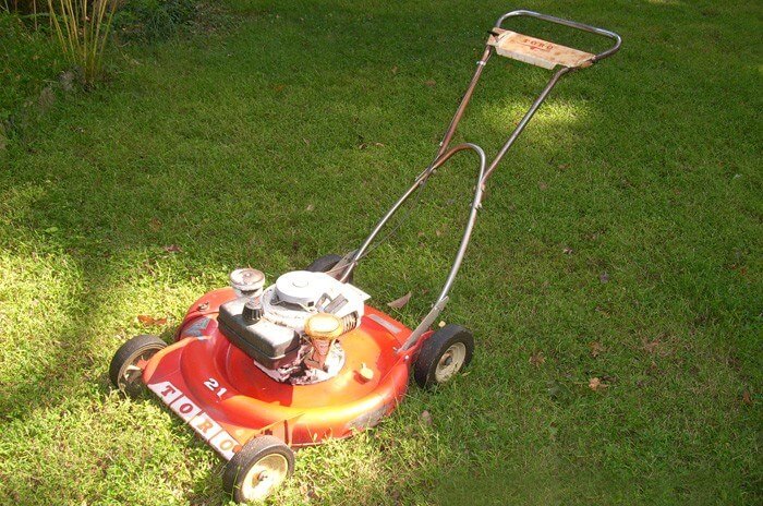 Toro lawnmower from 1968 in a green yard