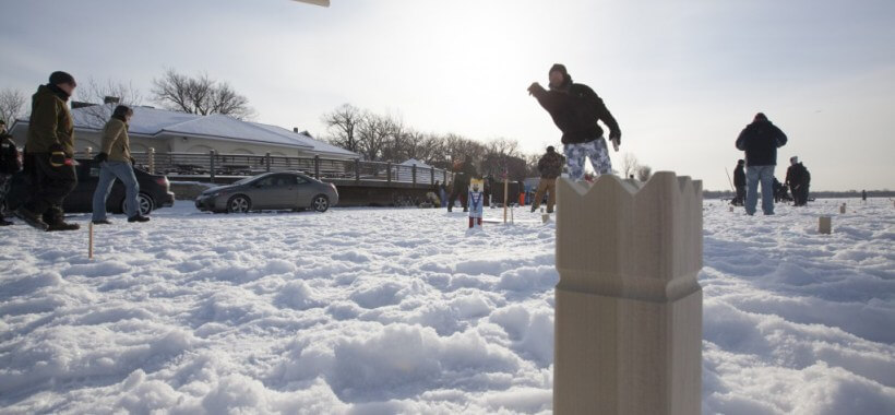 People playing in a snowy yard