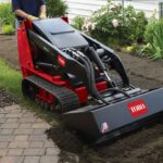 Toro Dingo digging up dirt in front yard