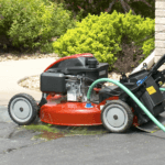 Lawnmower with hose plugged into it's deck