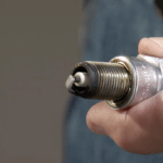 Close up of lawnmower spark plug