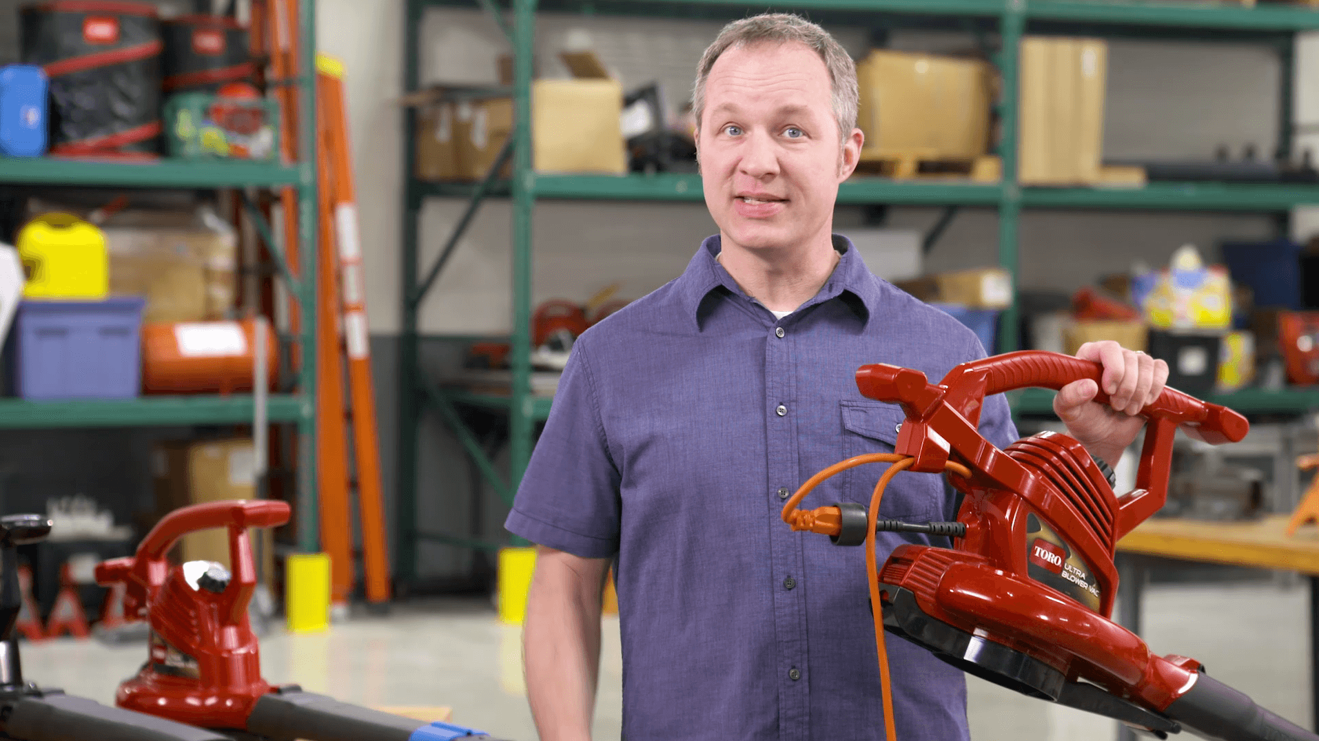 Man holding up Toro Ultra Blower Vac