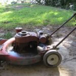 Old Toro mower covered in dirt