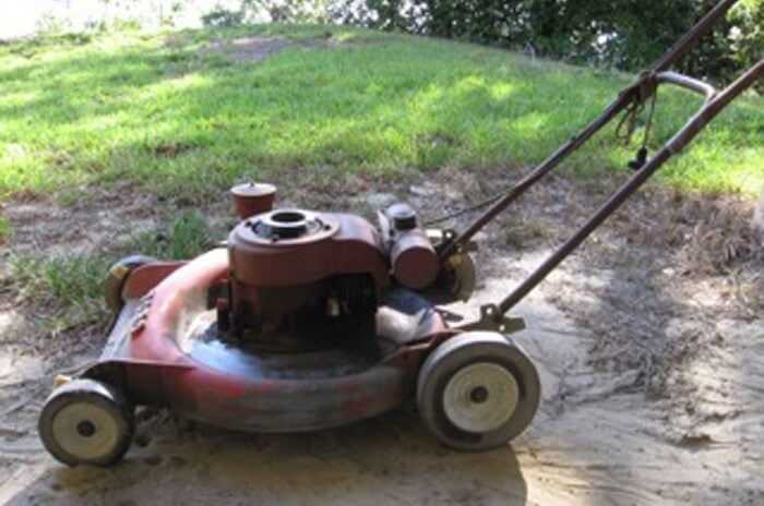 Old Toro mower covered in dirt