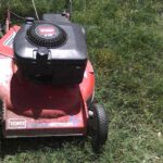 Close up of Toro lawnmower in green grass