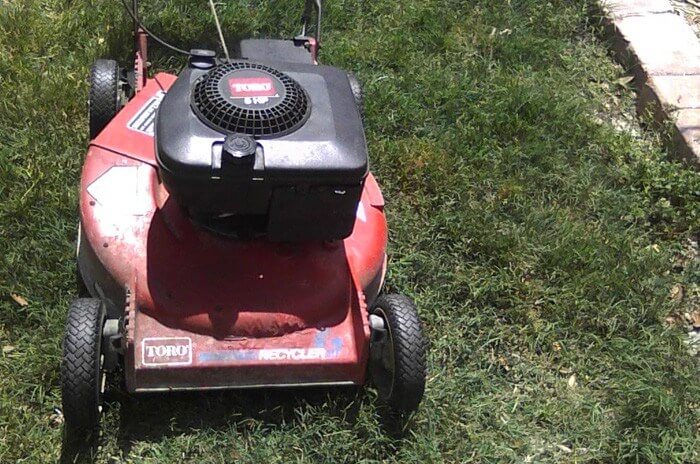 Close up of Toro lawnmower in green grass