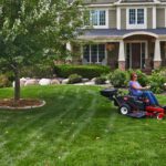 Woman using Toro Timecutter Z Seed Spreader in front yard