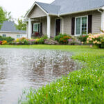 flooded front lawn of residential home